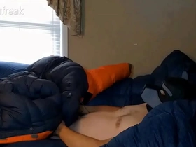 Humping big orange parka on puffy bed of down