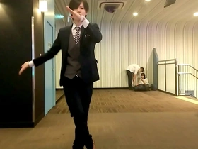 Japanese couple dances with an older man in a gay video.